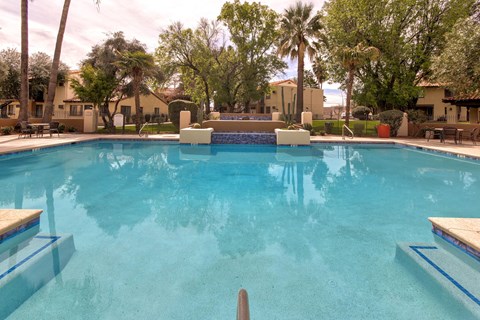 A swimming pool with a blue tinted water.