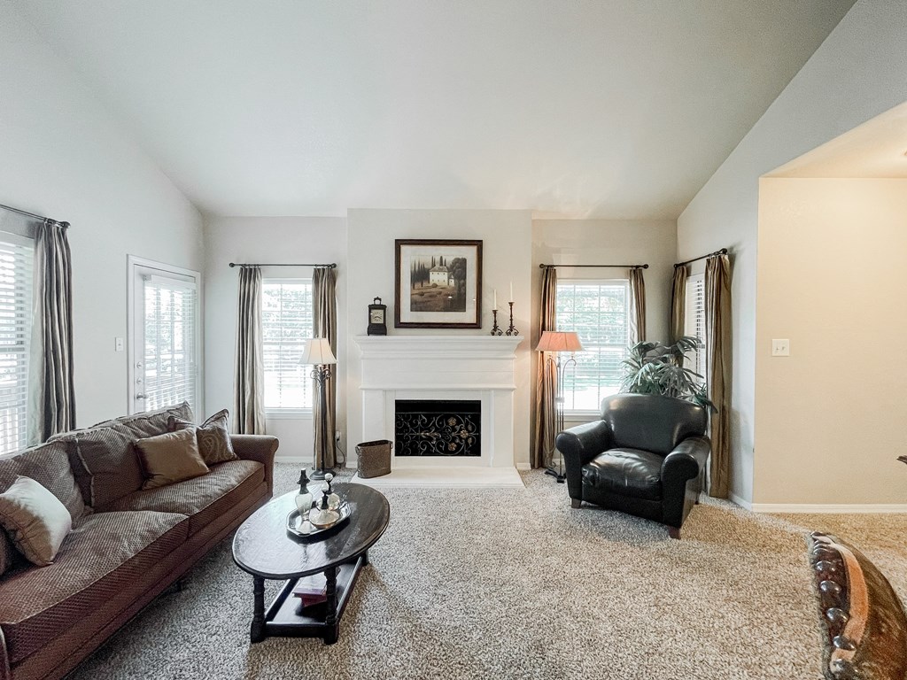 Living room with couch and table at SaddleBrook Apartments, Texas, 75248