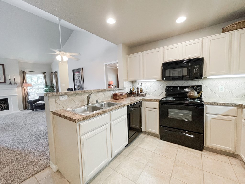  kitchen with stainless steel sink at SaddleBrook Apartments, Dallas, TX, 75248