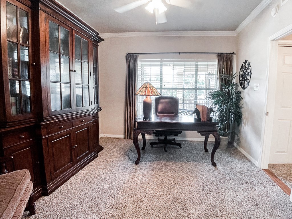 Office set up with beige carpeting at SaddleBrook Apartments, Dallas, TX