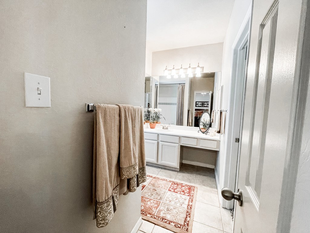 Bathroom area with vanity at SaddleBrook Apartments, Texas, 75248