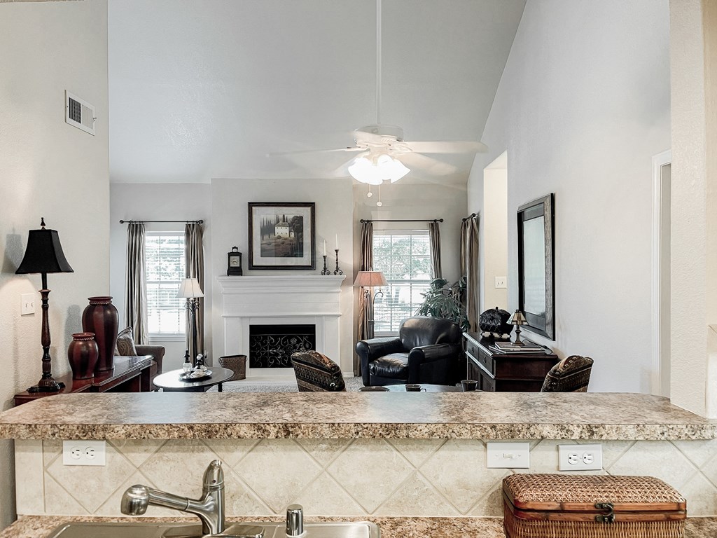 Kitchen view with countertop at SaddleBrook Apartments, Dallas, Texas
