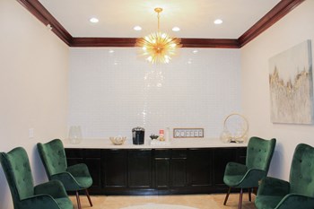 Coffee bar at Montfort Place in the clubhouse.  Two lounge chairs to sit and enjoy a cup of coffee. - Photo Gallery 24