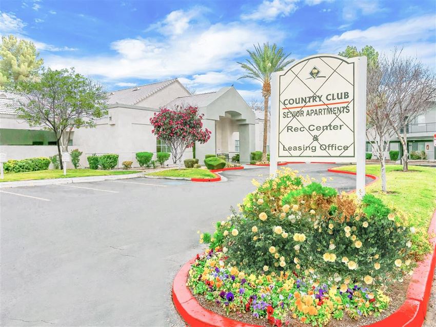 Curb appeal in front of Country Club at The Meadows Senior Apartments in Las Vegas, NV, For Rent. Now leasing 1 and 2 bedroom apartments. - Photo Gallery 1