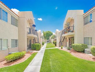 Lush walkways of Country Club at Valley View Senior Apartments in Las Vegas, NV, For Rent. Now leasing 1 and 2 bedroom apartments.