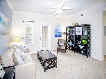 Spacious living room ceiling fan 1, 2, and 3 bedroom apartments for rent Estancia