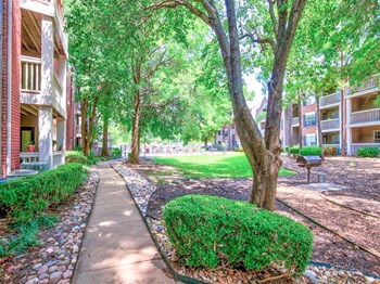 Mature trees, BBQs and a pet friendly apartment community in South Tulsa, OK. Now leasing apartments at Greenbriar. - Photo Gallery 3