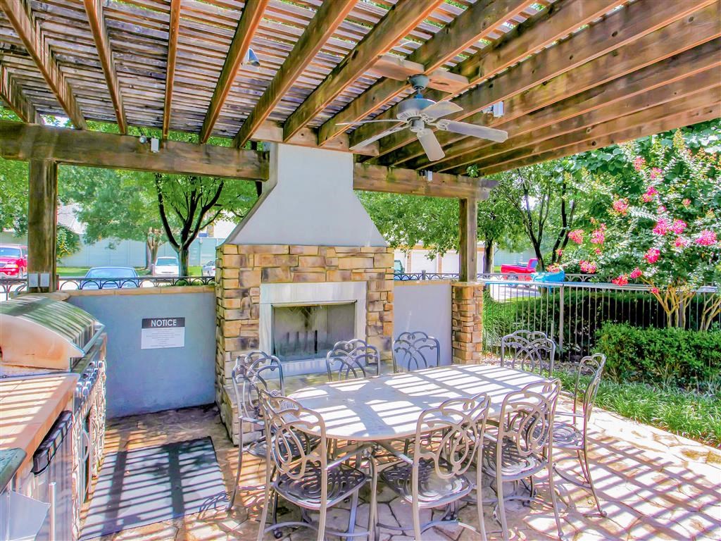 Outdoor fireplace and BBQ Grills at The Remington at Memorial in Tulsa, OK, For Rent. Now leasing 1 and 2 bedroom apartments.
