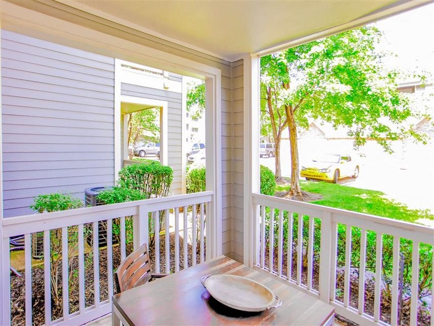 Outdoor dining in private patio at The Remington at Memorial in Tulsa, OK, For Rent. Now leasing 1 and 2 bedroom apartments.