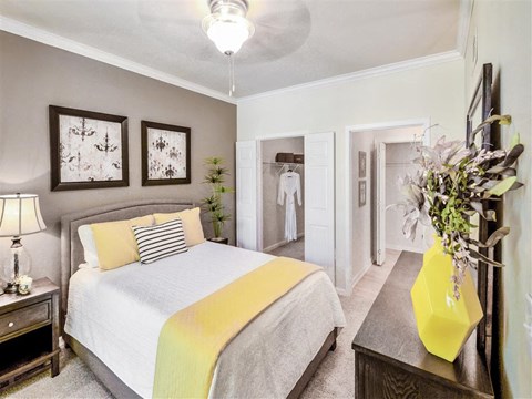 a bedroom with a bed and a closet