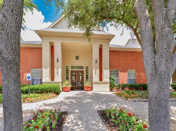 Lush entrance to Montfort Place in North Dallas, TX, For Rent. Now leasing 1 and 2 bedroom apartments. - Photo Gallery 4