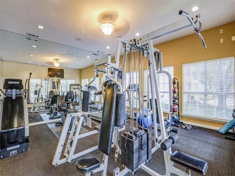 Fitness center with weight machines at Trinity Square, Dallas, TX