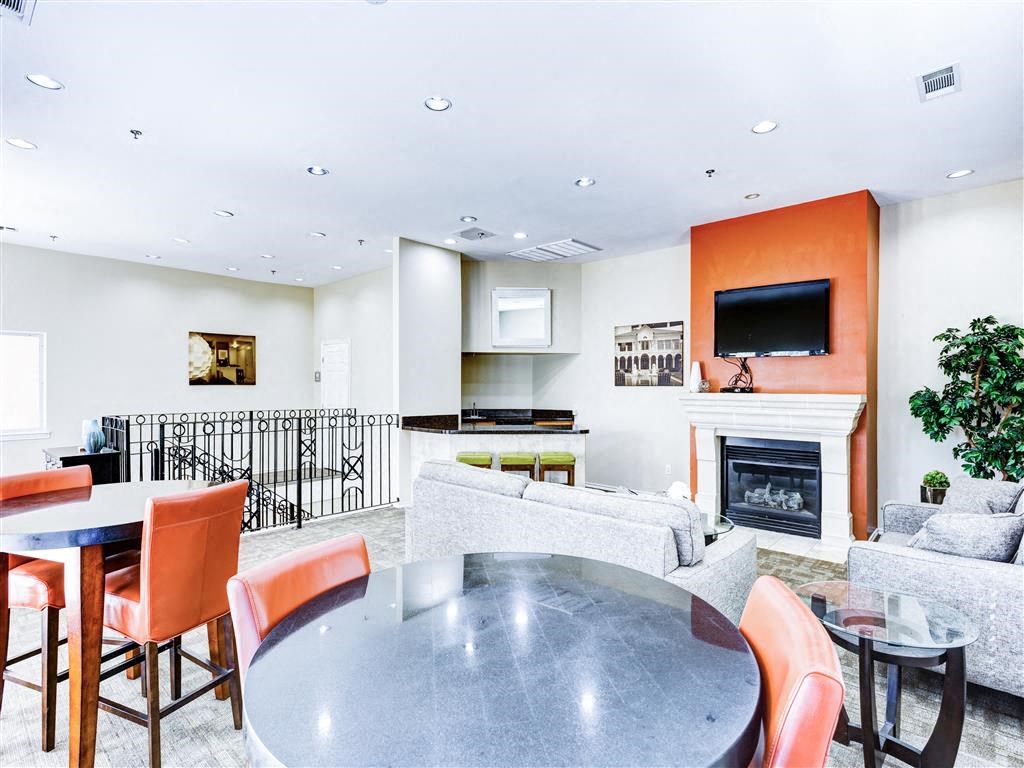 Fireplace and social areas at the Clubhouse at The Villas at Katy Trail in Uptown Dallas, TX, For Rent. Now leasing Studio, 1, 2 and 3 bedroom apartments.