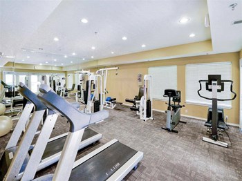 Cardio equipment at gym of The Villas at Katy Trail in Uptown Dallas, TX, For Rent. Now leasing Studio, 1, 2 and 3 bedroom apartments. - Photo Gallery 22
