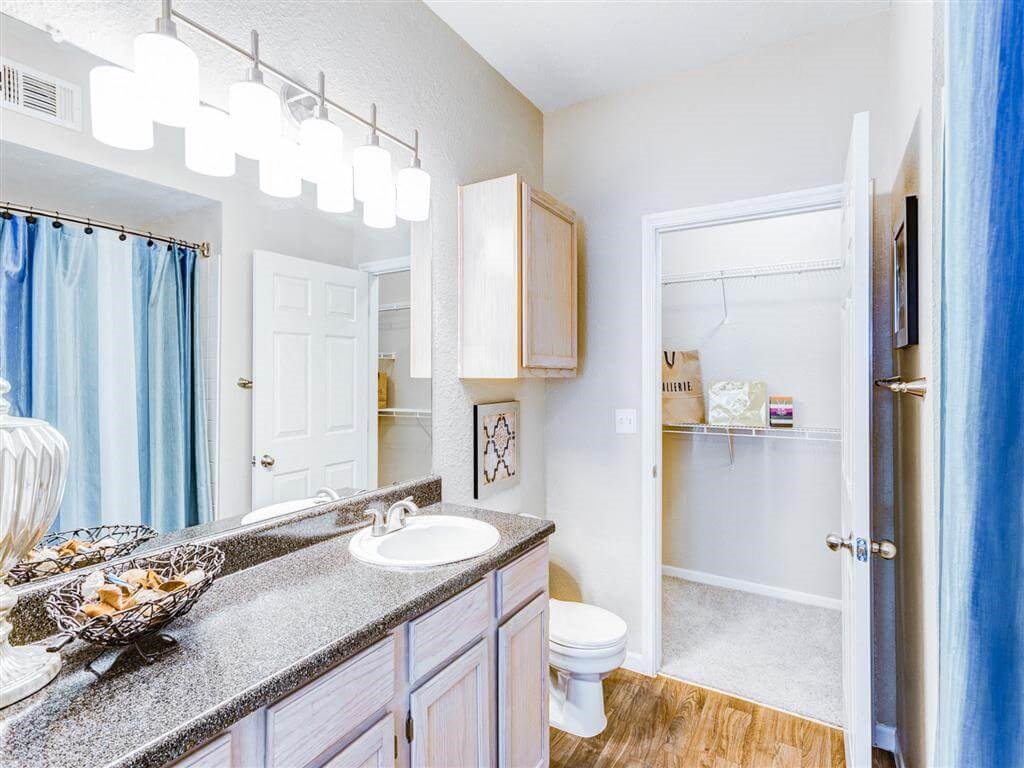 Walk in closet through bathroom at The Villas at Katy Trail in Uptown Dallas, TX, For Rent. Now leasing Studio, 1, 2 and 3 bedroom apartments.