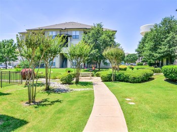 Lush landscaping of Cypress Lake at Stonebriar Apartments in Frisco, TX, For Rent. Now leasing 1, 2 and 3 bedroom apartments. - Photo Gallery 3