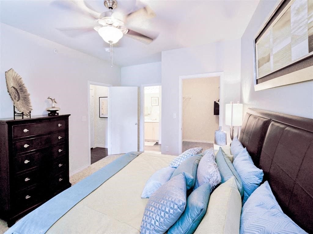 Bed, ceiling fan and light at Mission at La Villita Apartments, Texas