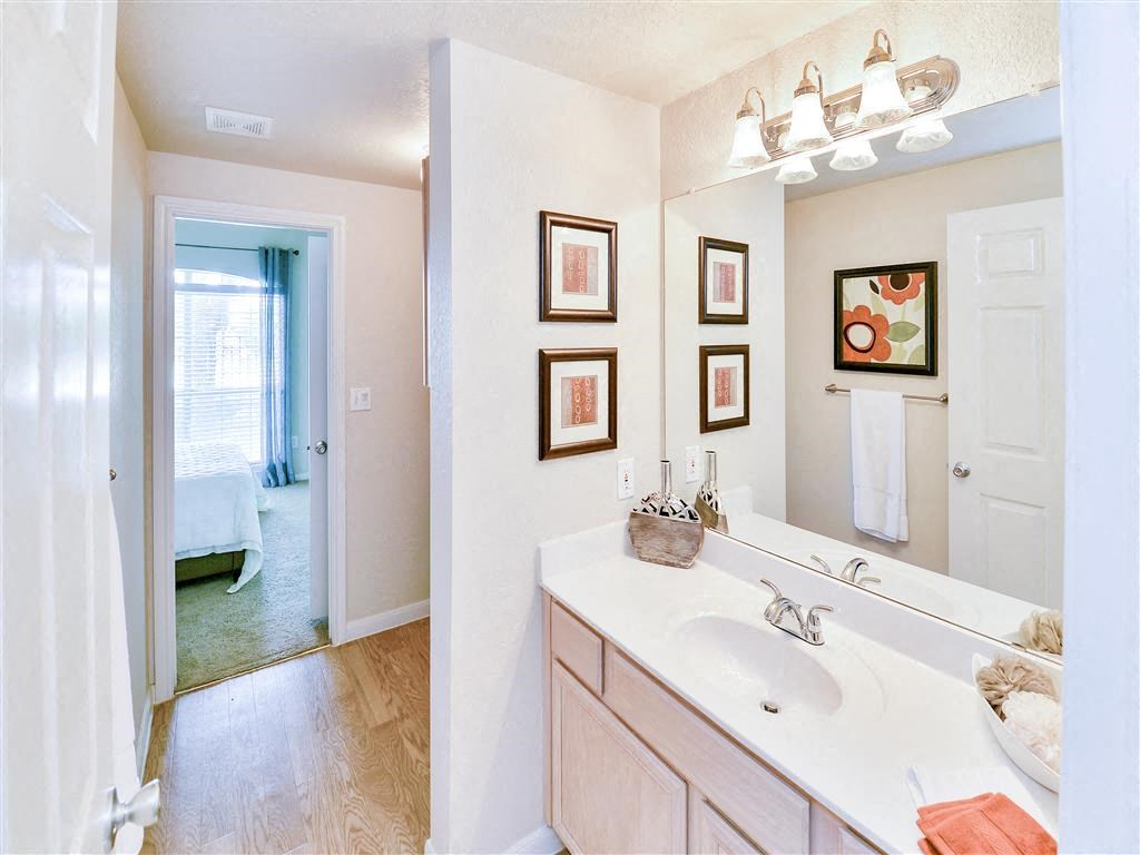 Mirrored vanity bathroom at Bentley Place at Willow Bend Apartments in West Plano, TX, For Rent. Now leasing 1, 2, and 3 bedroom apartments.