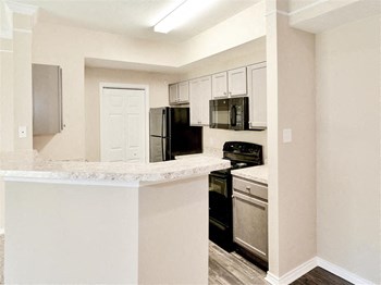 Microwave, dishwasher, disposal and ice maker in every kitchen of Saxony at Chase Oaks in North Plano, TX, For Rent. Now leasing 1, 2 and 3 bedroom apartments. - Photo Gallery 13