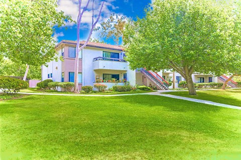 Balcony, patio with views of lush landscaping at Village Park Apartments in Encinitas, CA, For Rent. Now leasing 2 and 3 bedroom apartments.