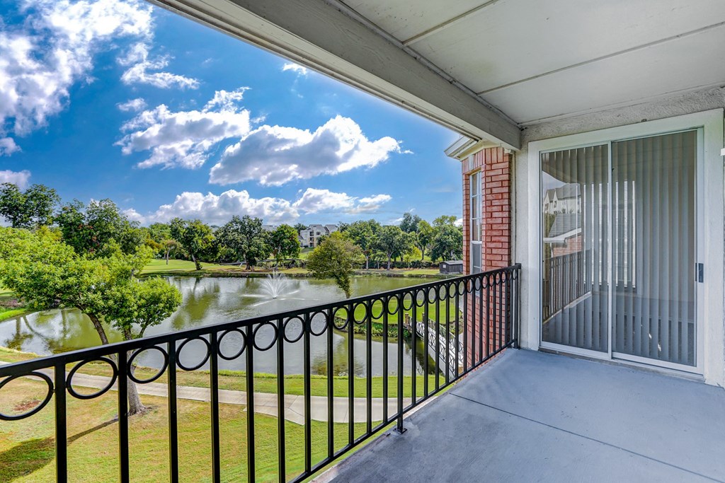Large balcony and patio with golf course views at Turnberry Isle Apartment Homes, Dallas, TX