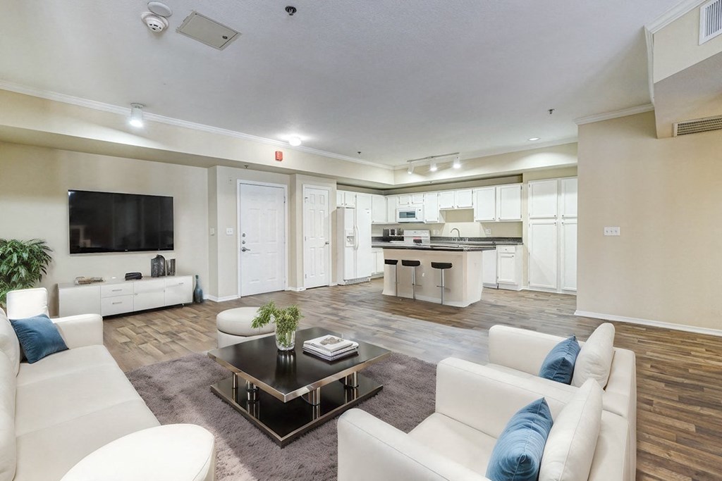 Living Room With Kitchen View at Villas at Katy Trail Apartments, Dallas, Texas