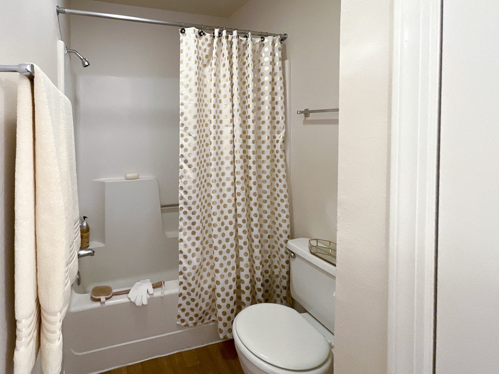 Bathroom with white walls, tub and shower at Greenbriar Apartments, Tulsa, Oklahoma