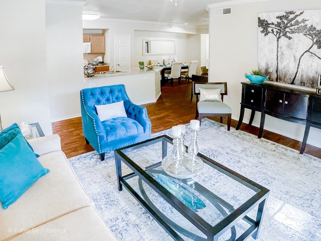 Interior living room view with seating and coffee table at Gates de Provence Apartments, Texas, 75287