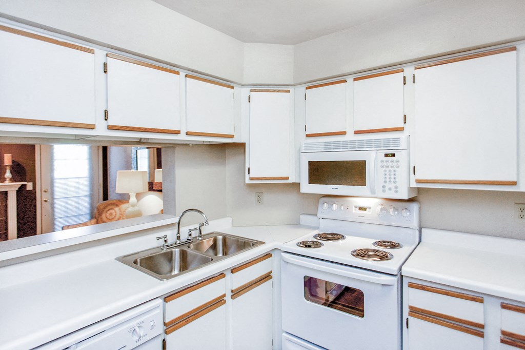 Kitchen appliances with white cabinets and appliances at Riverside Park Apartments, Oklahoma, 74136