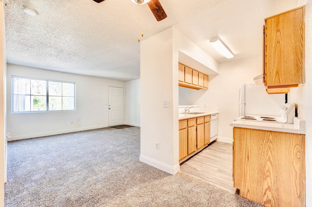 Open concept kitchen with view of living room and dining room at Country Club at The Meadows, Las Vegas, 89107