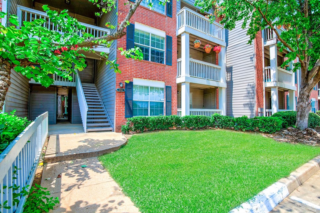 Exterior of apartments with staircase at Greenbriar Apartments, Tulsa, 74136