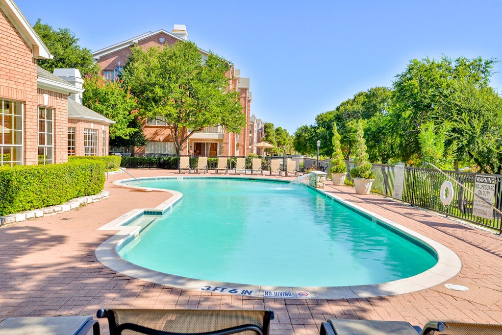 Large swimming pool with tree lined view at Turnberry Isle Apartment Homes, Dallas, 75248