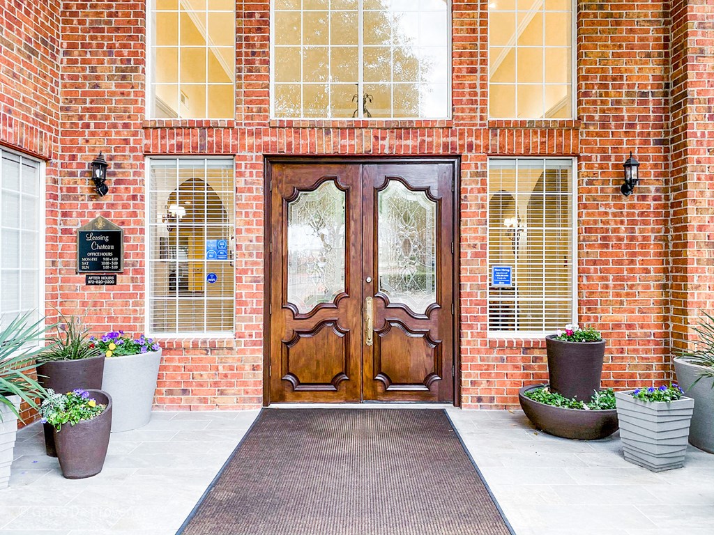 Leasing office entry way with wooden door at Gates de Provence Apartments, Texas