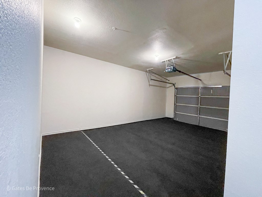 Interior view of resident parking garage at Gates de Provence Apartments, Dallas 75287