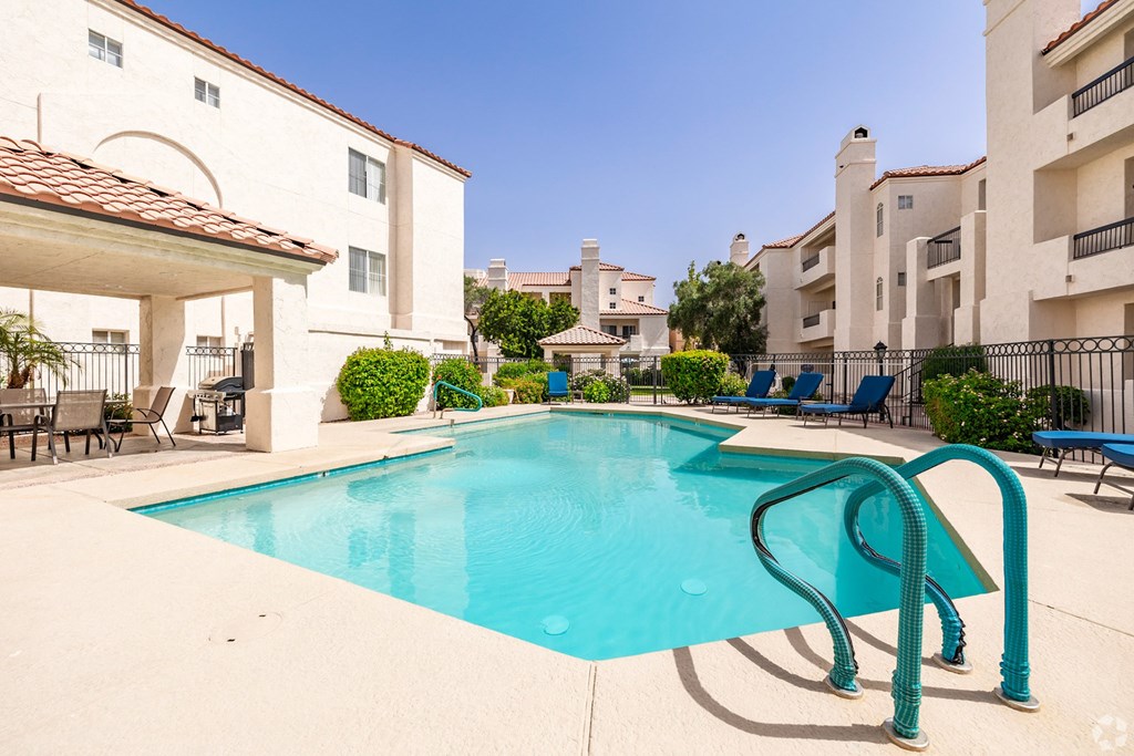 Pool view with tan stone around it at Ventana, Arizona, 85260