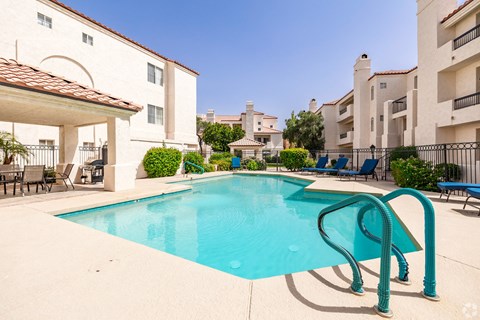 Pool view with tan stone around it at Ventana, Arizona, 85260