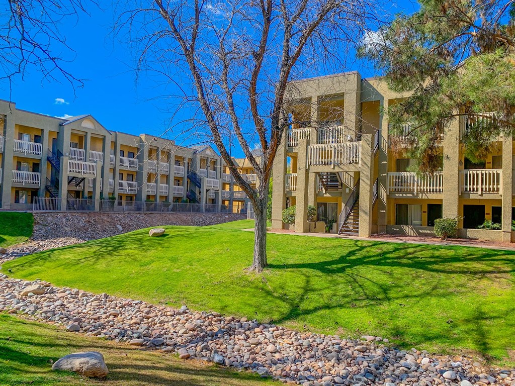 Community filled with lush landscaping and mature trees at Pavilions at Pantano Apartments in Tucson, AZ!