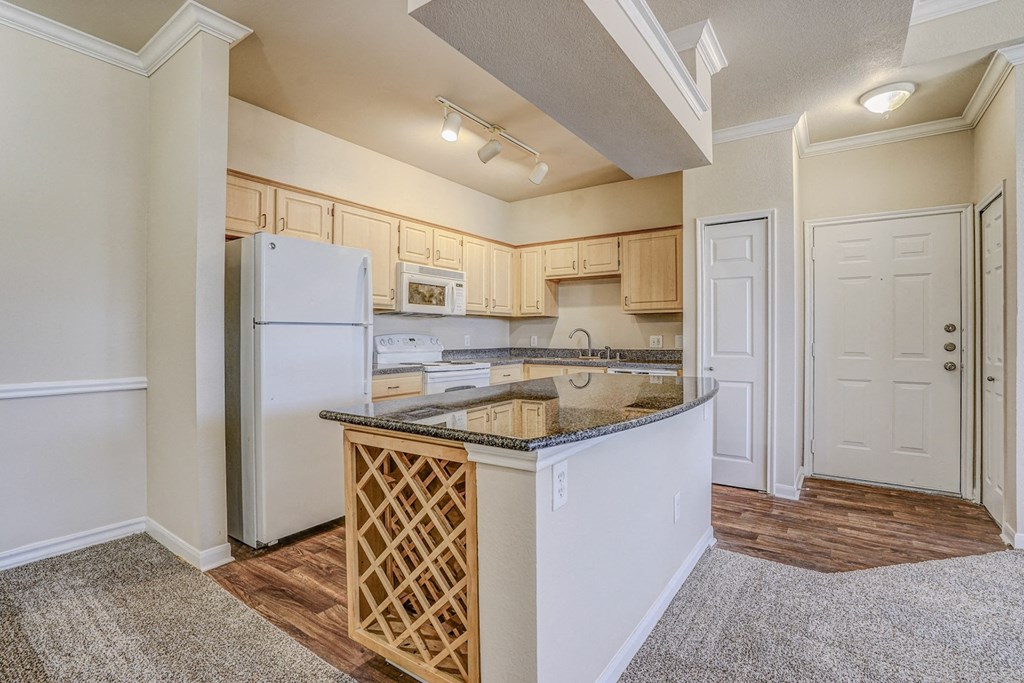 Bright and spacious kitchen with built in wine racks at Cypress Lake at Stonebriar in Frisco, TX!