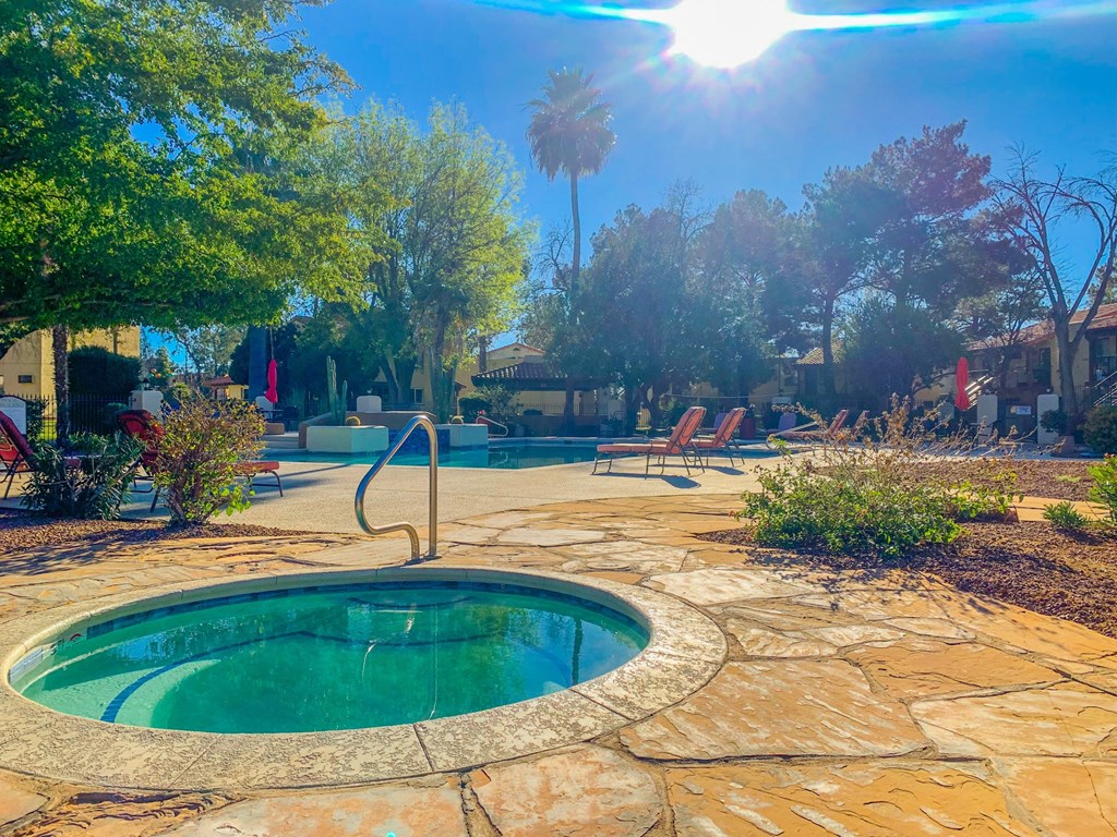Outdoor Jacuzzi surrounded by tan stone at La Hacienda Apartment, Tucson, AZ, Arizona, 85712