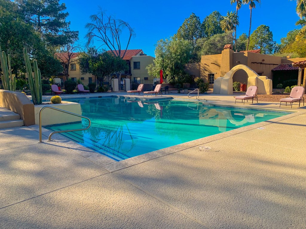 Resort-style swimming pool on a shady afternoon at La Hacienda Apartment, Tucson, AZ