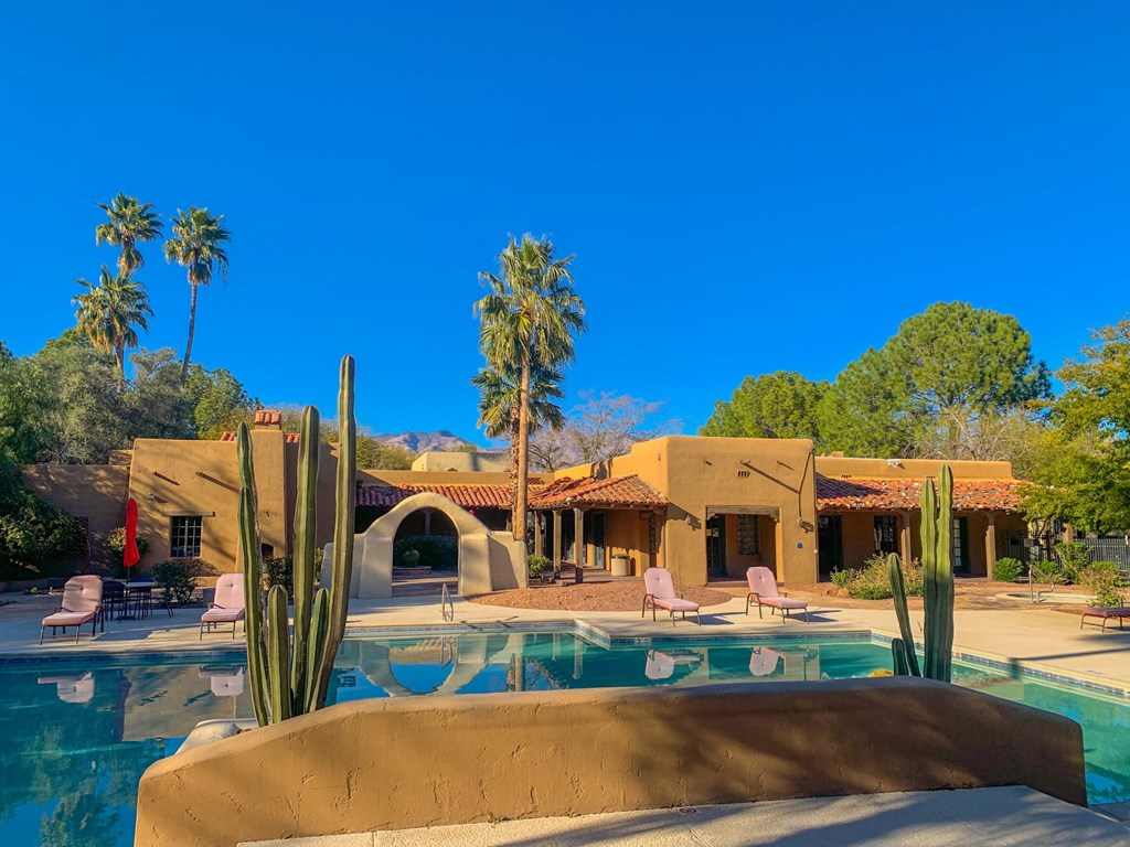 View of clubhouse and outdoor swimming pool at La Hacienda Apartment, Arizona, 85712