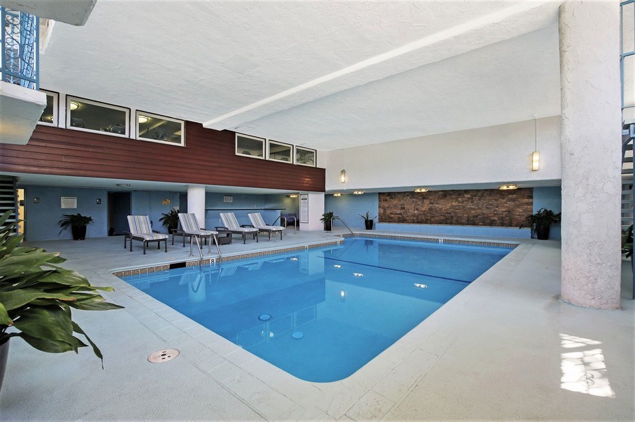 the lobby of a hotel with a swimming pool