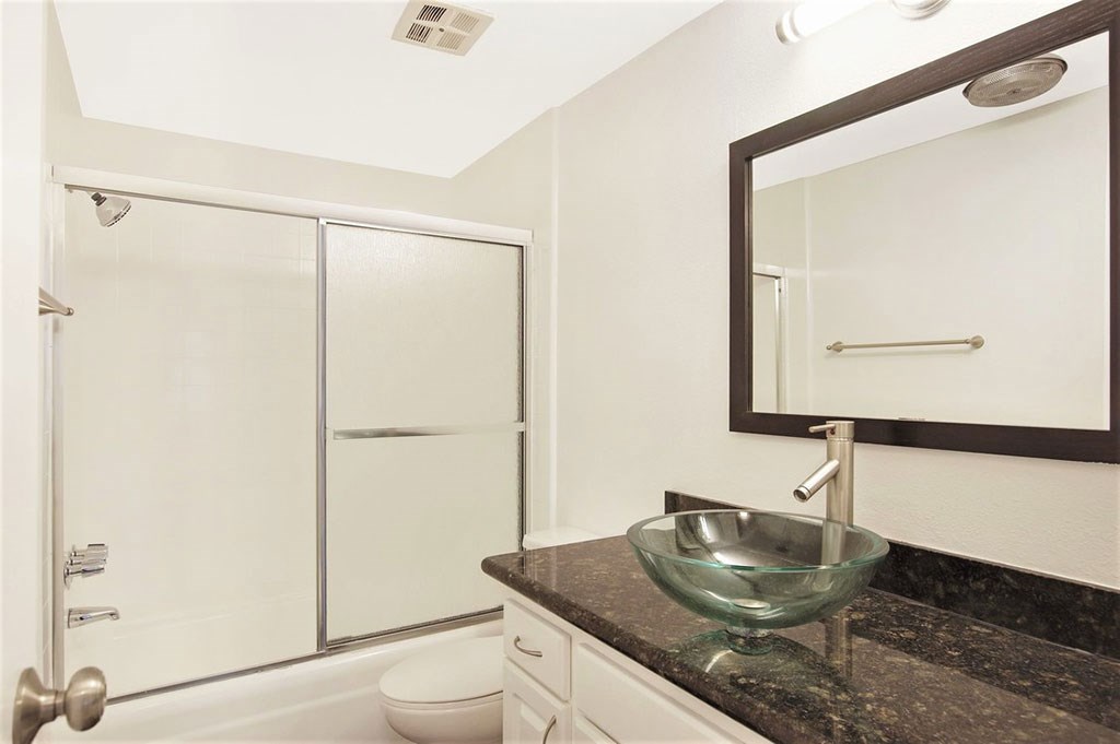 a bathroom with a sink and a shower