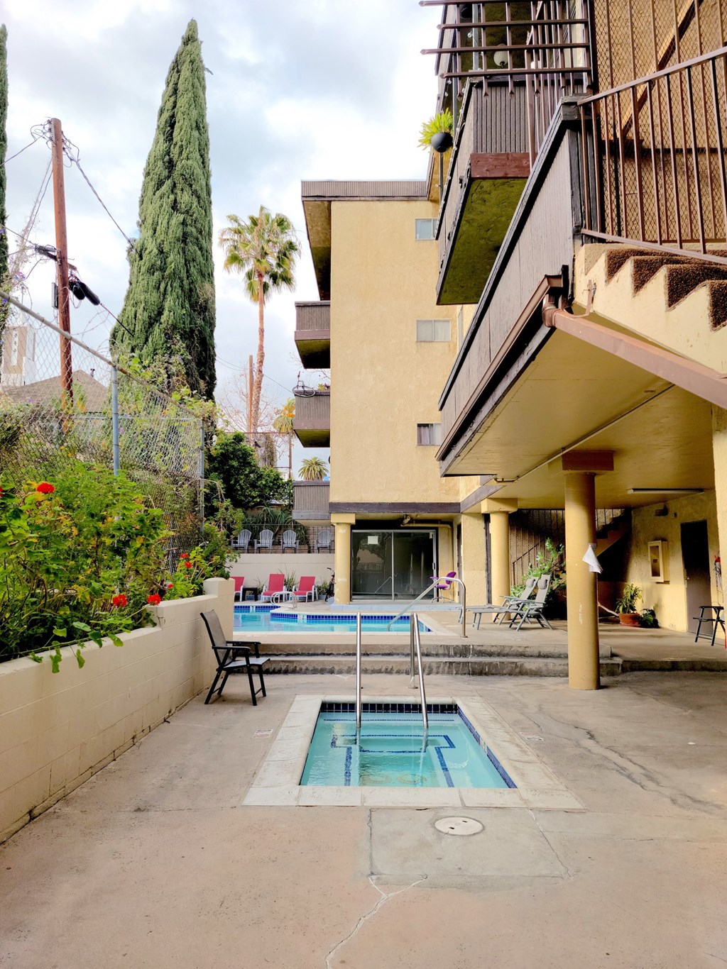 Pool area and Jacuzzi at The DRACENA Apts, Los Feliz, Los Angeles, California