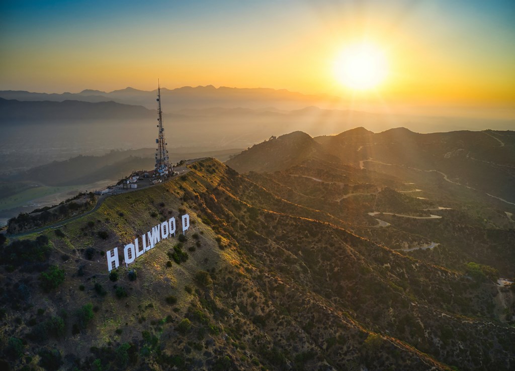 a sunset over the hollywood sign in los angeles