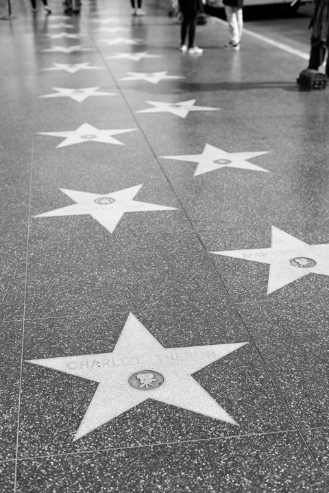 a black and white photo of the hollywood walk of fame
