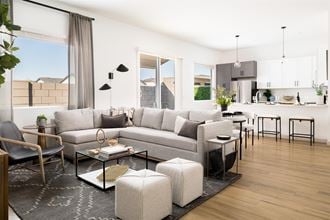 a rendering of a living room and kitchen in an apartment