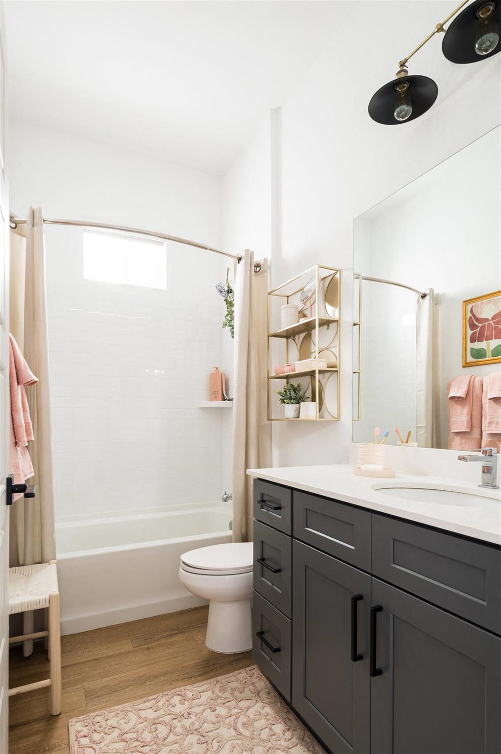 a bathroom with a shower and a sink and a toilet