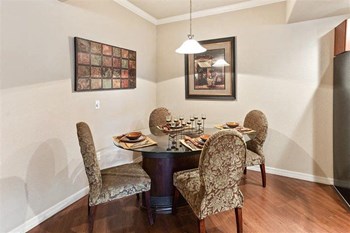 Superstition Canyon dining area Photo of a model apartment showing dining table in dining area with four chairs and hanging pendant light - Photo Gallery 6