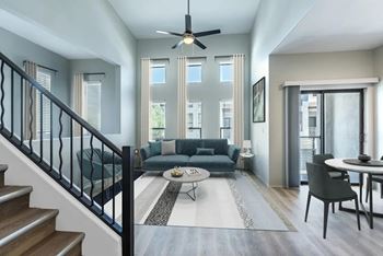 A modern living room with a staircase leading to the upper floor.